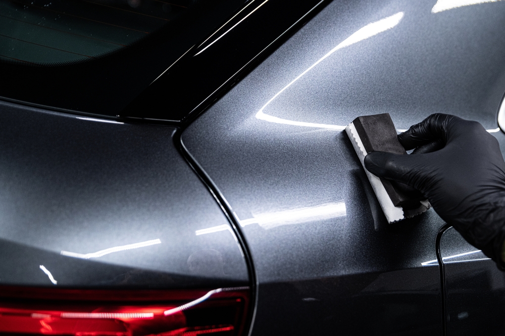 Car,detailing,or,car,wash,worker,aplying,ceramic,coating,on