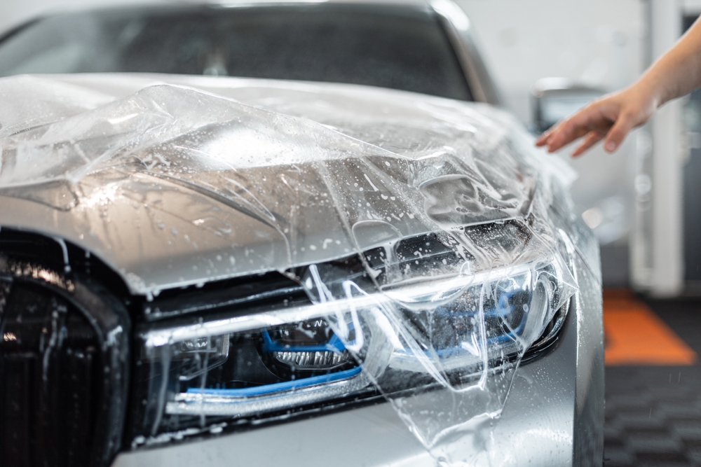 Car,on,detailing,service.,protection,of,car,hood,with,ppf
