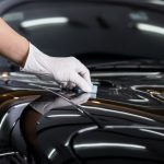 Car,detailing,series,:,closeup,of,hand,coating,black,car